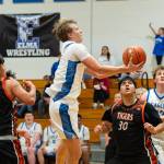 NICOLE SHANNON | MAIN FOCUS MEDIA Elma senior Isaac McGaffey scores on a drive to the basket during the a 66-56 win over Centralia on Tuesday at Elma High School.