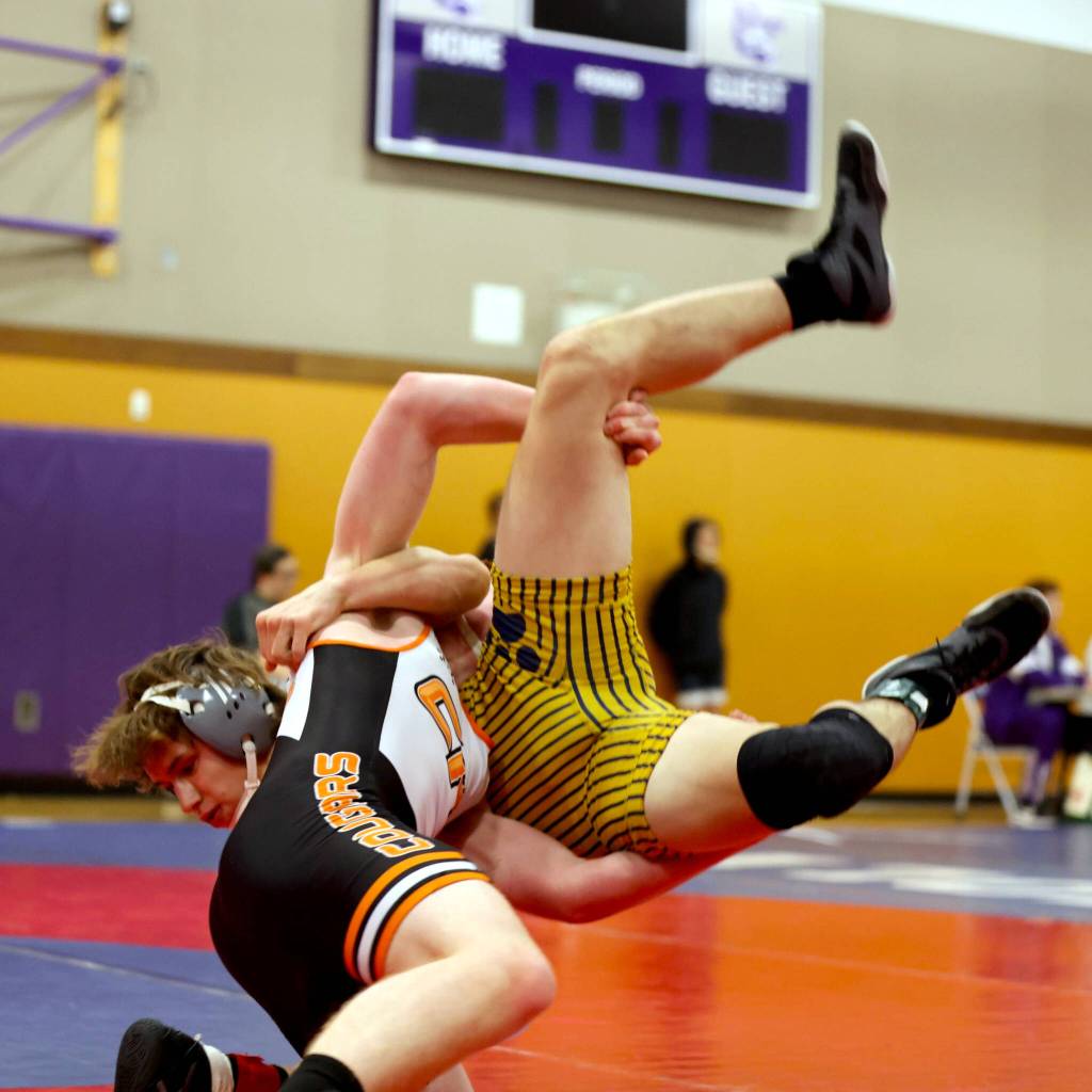 ERICA MCCRORY | MCCRORY PHOTOGRAPHY Aberdeens Ethan Parris (background) wrestles during the Ramrock Invitational on Saturday at North Thurston High School.