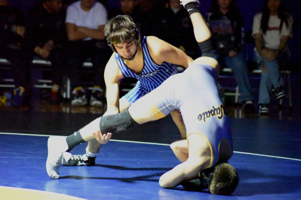 PHOTO BY SUE MICHALAK BUDSBERG Elmas Xavier Espinoza (top) competes in a dual meet against Wapato on Friday at Wapato High School.