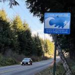John Ryan / KUOW
A car exits a tsunami hazard zone on state Route 109 north of Moclips last January.