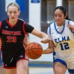 PHOTO BY MIKE ROBERTS Montesanos Kahlea Tolentino (12) dribbles up court while defended by Mossyrocks Audrey Ollikainen during the Eagles 51-39 loss on Monday in Elma.