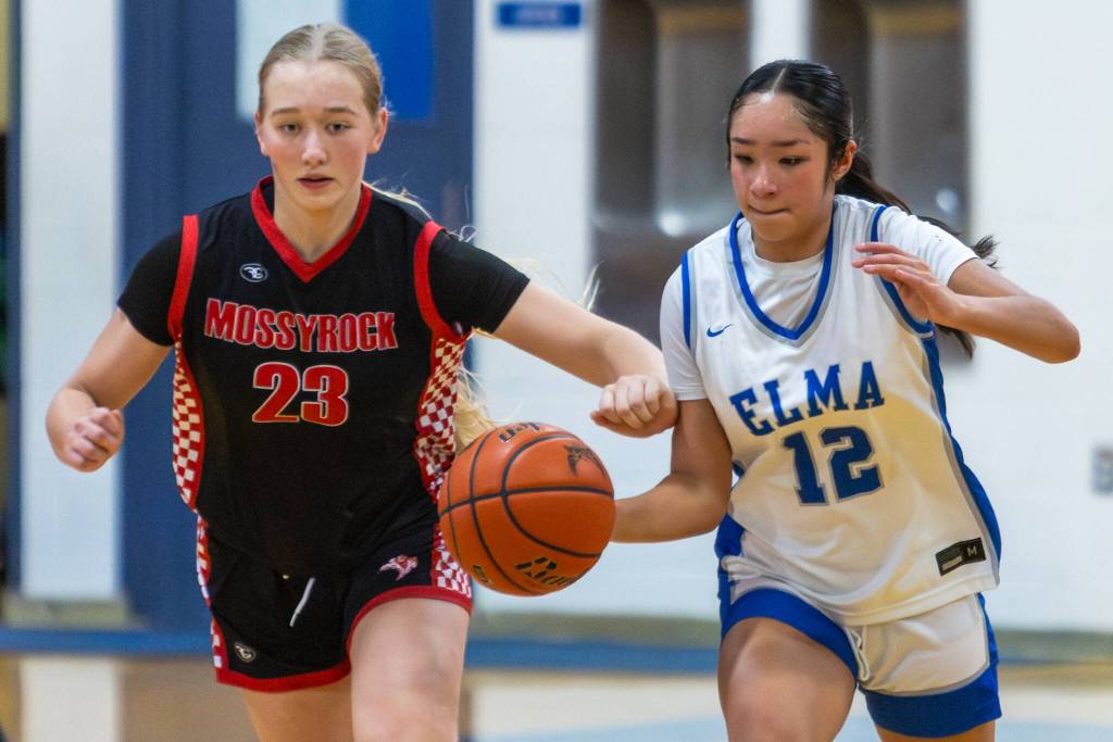 PHOTO BY MIKE ROBERTS Montesanos Kahlea Tolentino (12) dribbles up court while defended by Mossyrocks Audrey Ollikainen during the Eagles 51-39 loss on Monday in Elma.