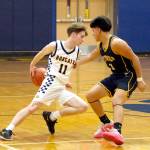 RYAN SPARKS | THE DAILY WORLD Aberdeen guard Justin Howard (11) dribbles behind the back against Forks Estevan Ramos during a 62-34 victory on Wednesday in Aberdeen.