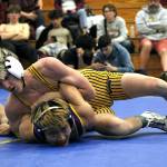 PHOTO BY ADONIS HAMMONDS Aberdeens Ryder Lessard (top) controls Highlines Thomas Nguyen en route to a decisive 10-0 victory in the 120-pound championship match at the Larry Brown Invitational on Saturday at Fife High School.
