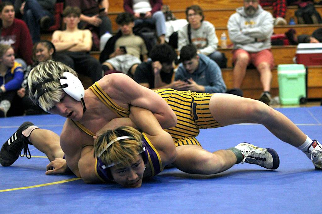PHOTO BY ADONIS HAMMONDS Aberdeens Ryder Lessard (top) controls Highlines Thomas Nguyen en route to a decisive 10-0 victory in the 120-pound championship match at the Larry Brown Invitational on Saturday at Fife High School.