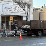Jerry Knaak / The Daily World
Workers clear debris from the fallen facade of the Grays Apartment building on the 200 block of E Wishkah in Aberdeen.