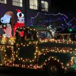 Montesano Mayor Tyler Trimble waves from the back of his vintage pickup truck float at the grand parade.