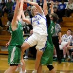 RYAN SPARKS | THE DAILY WORLD Elma guard Tanner Moe (middle) draws a foul during a 62-50 loss to Tumwater on Tuesday in Elma.