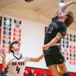 OTTO RABE | THE CHRONICLE Raymond-South Bends Chris Banker (12) blocks the shot of Teninos Cole Borup during the Ravens 51-48 win on Friday at Tenino High School.