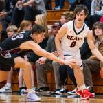 OTTO RABE | THE CHRONICLE Raymond-South Bends Carson Ridderbush (left) defends Teninos Owen Whitaker in the Ravens 51-48 victory on Friday at Tenino High School.