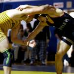 ERICA MCCRORY / MCCRORY PHOTOGRAPHY Aberdeens Glenny Black (left) and Hoquiams Kingston Case wrestle in the 165-pound final of the Grays Harbor Championships on Saturday at Sam Benn Gym in Aberdeen. Black won the match 5-4, avenging a loss to his cousin earlier in the season.
