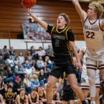 PHOTO BY FOREST WORGUM Aberdeens Ryker Scott (left) glides to the basket against Montesanos Mason Fry during the Bobcats 63-53 victory on Monday in Montesano.
