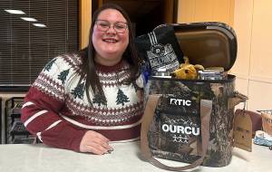 The Daily World
Keisha Dean poses for a photo with the gift basket she won in the OURCU Live Here - Shop Here trivia contest.