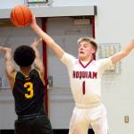 RYAN SPARKS | THE DAILY WORLD Hoquiam guard Ryker Maxfield (1) deflects the pass of Overlakes Abem Berga during the Grizzlies 55-54 victory on Tuesday at Hoquiam Square Garden.