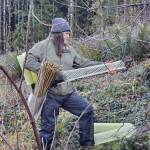 Andrea Watts / The Daily World
Emma Stohrer, who is in her second year of an associates degree program in forest resources management at Grays Harbor College, is placing vexar tubing around the seedlings that are being planted.