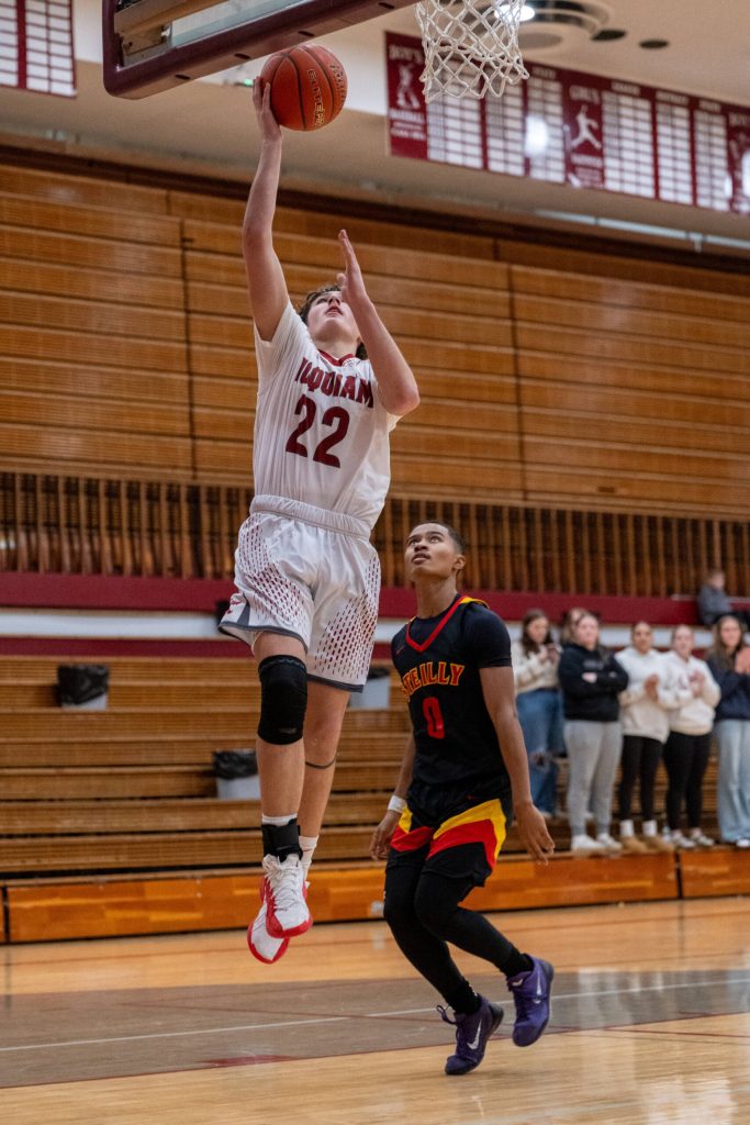 PHOTO BY FOREST WORGUM Hoquiam freshman K.J. McCoy (22) glides in for two of his 16 points during a 69-52 win over Steliacoom on Saturday at Hoquiam High School.