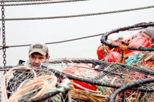 Luke Whittaker photos / Chinook Observer
Commercial fisherman Travis Kary loads crab pots on Friday, Dec. 26.