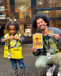 Timberland Regional Libraries
Mychal Threets poses for a photo with Workman MJ at the Lacey Timberland Library.