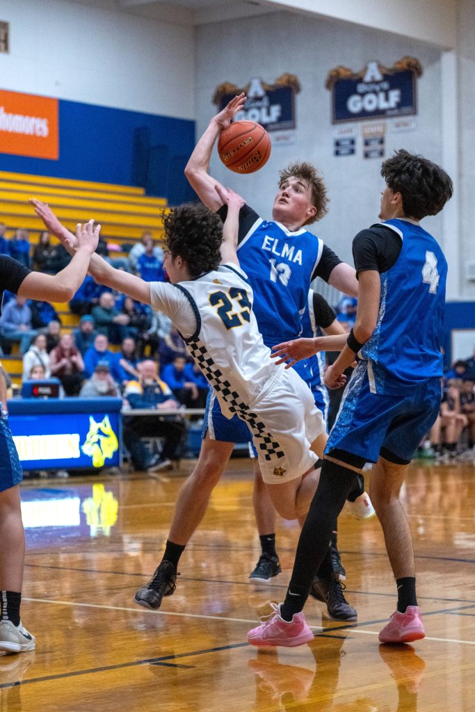 PHOTO BY FOREST WORGUM Elmas Dylan Myer (13) defends Aberdeens Jhacob Quezada in the final seconds of Elmas 68-66 win on Tuesday in Aberdeen.