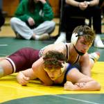 PHOTO BY SUE MICHALAK BUDSBERG Montesanos Gage Stutesman (top) wrestles against East Jeffersons Grady White during the 165-pound championship match of The Rock Tournament on Tuesday at Vashon Island High School.