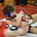 PHOTO BY SUE MICHALAK BUDSBERG Elmas Aidyn Johnson (top) wrestles Castle Rocks Boston Carter during the 126-pound title match of the Jim Bair Invitational on Saturday at Castle Rock High School.