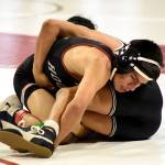 PHOTO BY SUE MICHALAK BUDSBERG Hoquiams Junior Balagot (facing) controls Black Hills Roberto Rivera-Jesus during the 120-pound final of the Jim Bair Invitational on Saturday at Castle Rock High School.
