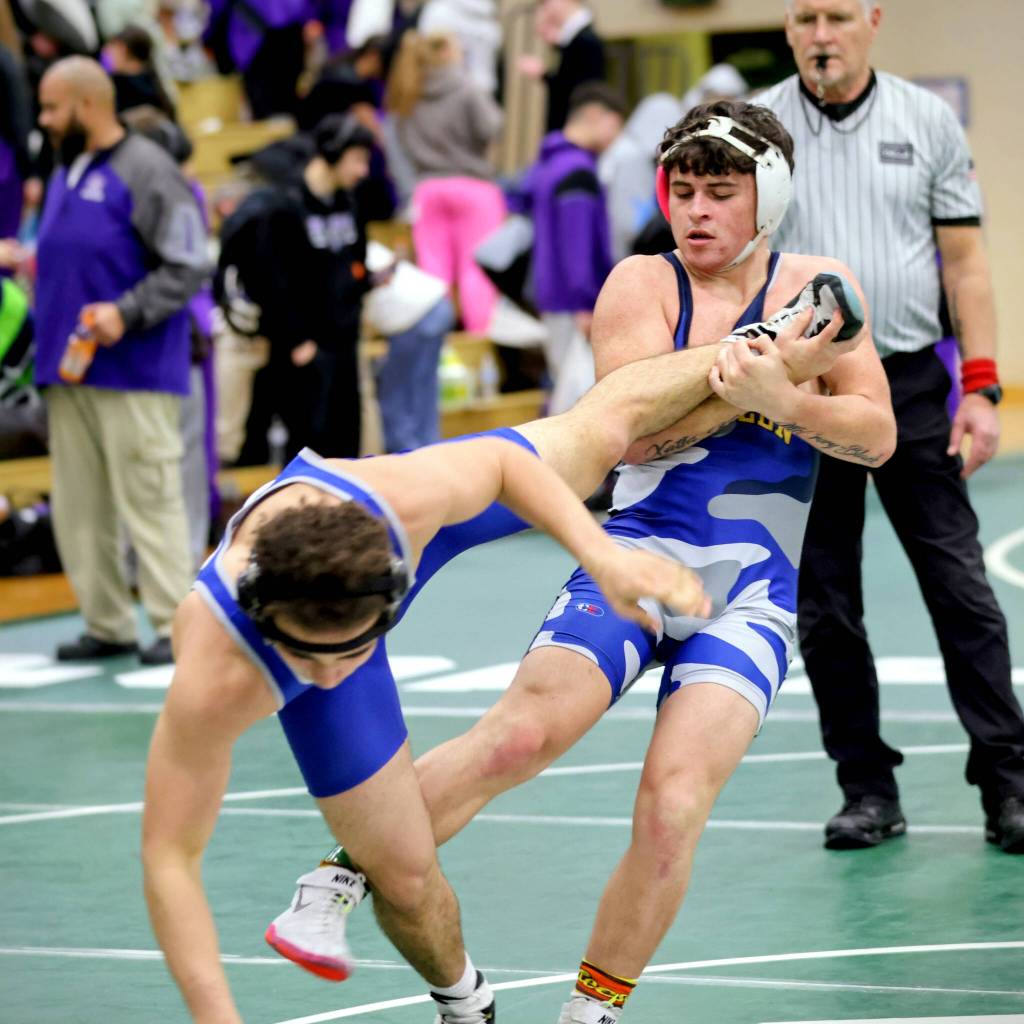 ERICA MCCRORY | MCCRORY PHOTOGRAPHY Aberdeens Glenny Black (right) controls the leg of an opponent at the Battle for the Axe dual-meet tournament on Saturday at Port Angeles High School.