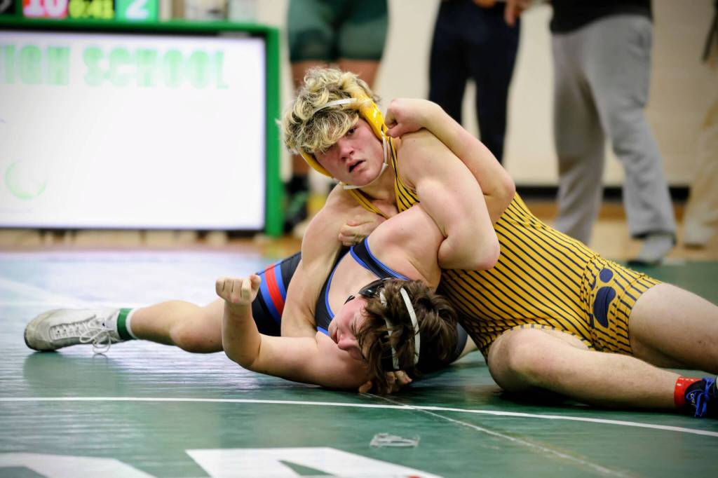 ERICA MCCRORY | MCCRORY PHOTOGRAPHY Aberdeens Jimmie Gertson (right) works to pin an opponent during a match at the Battle for the Axe dual-meet tournament on Saturday in Port Angeles.