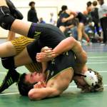 PHOTO BY ADONIS HAMMONDS Aberdeens Ryder Lessard (background) works to earn a pinfall win over North Kitsaps Noah Lansford during a 120-pound match at the Battle for the Axe dual-meet tournament on Saturday in Port Angeles.