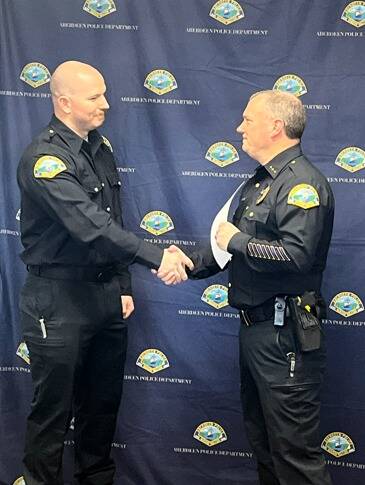 APD photo
Officer Stefan Green shakes hands with APD Chief of Police Dale Green after officially joining the department.