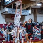 PHOTO BY FOREST WORGUM Montesanos Mason Fry attempts a dunk against Teninos Robert Nelson during the Bulldogs 74-21 league-opening victory on Tuesday at Montesano High School.