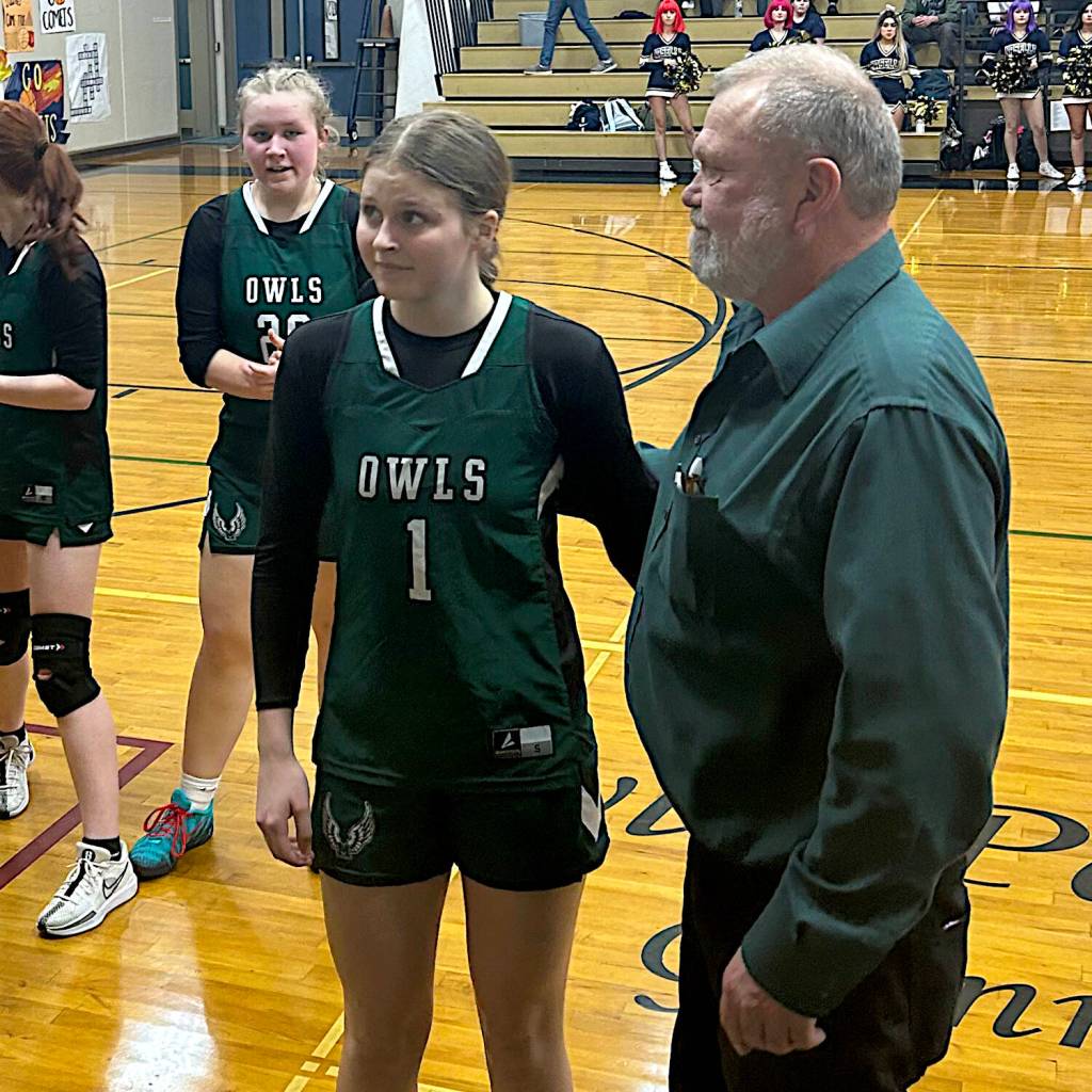 SUBMITTED PHOTO Mary M. Knight senior guard Cloey Fletcher (1) stands next to Owls head coach Jake Goldy after scoring the 1,000th point of her stellar prep career in a 63-31 loss to Naselle on Wednesday at Naselle High School.