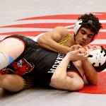 ERICA MCCRORY | MCCRORY PHOTOGRAPHY Aberdeen senior Adonis Hammonds (top) wrestles against Wahkiakums Kaydin Jaksha during a 144-pound match at the Ron Baze Memorial Invitational on Saturday at Hoquiam High School. Hammonds later defeated Hoquiams Brayden Gonzalez to place first in the weight class.
