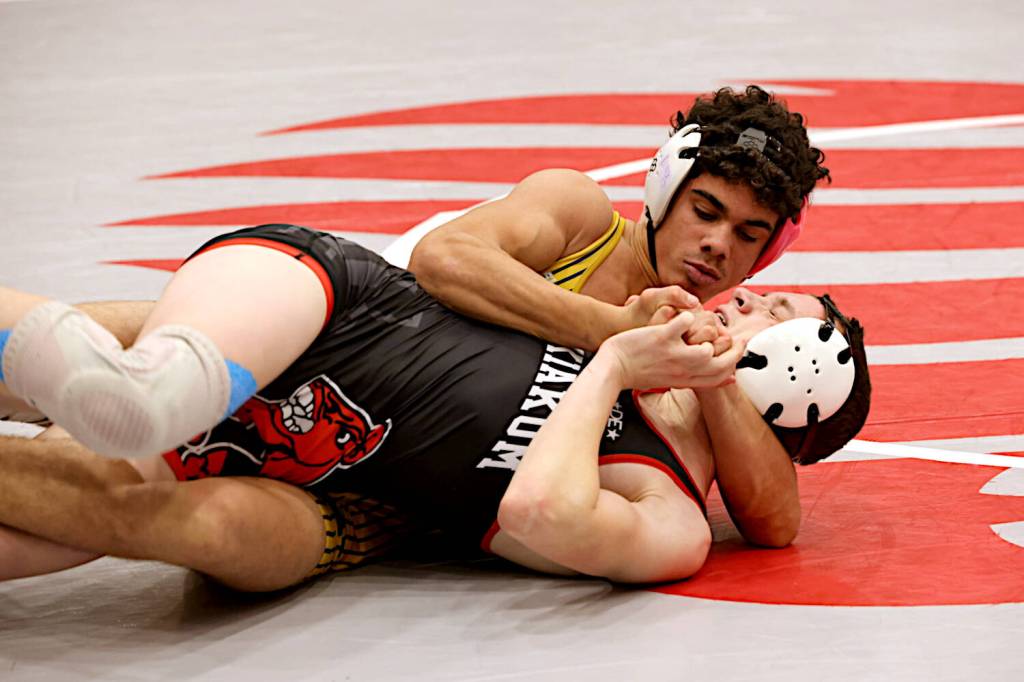 ERICA MCCRORY | MCCRORY PHOTOGRAPHY Aberdeen senior Adonis Hammonds (top) wrestles against Wahkiakums Kaydin Jaksha during a 144-pound match at the Ron Baze Memorial Invitational on Saturday at Hoquiam High School. Hammonds later defeated Hoquiams Brayden Gonzalez to place first in the weight class.