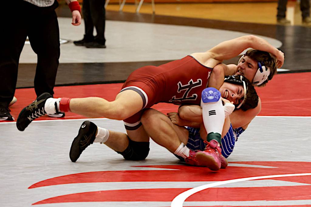 ERICA MCCRORY | MCCRORY PHOTOGRAPHY Hoquiams Kingston Case (left) wrestles against Elmas Jackson Bucy during in a 157-pound match at the Ron Baze Memorial Invitational on Saturday at Hoquiam High School. Case would advance to win the weight class.