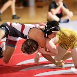 ERICA MCCRORY | MCCRORY PHOTOGRAPHY Hoquiams Junior Balagot (left) and Aberdeens Ryder Lessard wrestle in the 120-pound championship match of the Ron Baze Memorial Invitational on Saturday at Hoquiam High School.