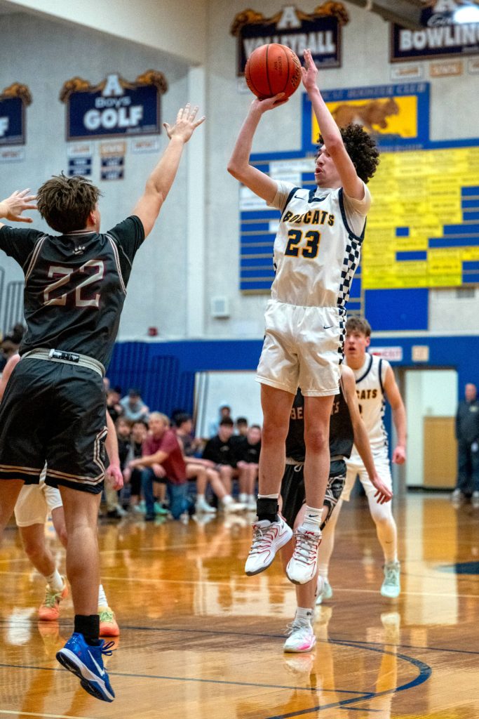 PHOTO BY FOREST WORGUM Aberdeen guard Jhacob Quezada (23) pulls up for a jump shot against W.F. Wests Hayden Rooney during the Bobcats 62-51 victory on Tuesday in Aberdeen.