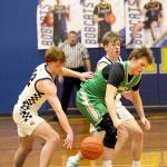RYAN SPARKS / THE DAILY WORLD 
Aberdeens Gabe Matthews (left) and Ryker Scott force a turnover by Tumwaters Dylan Carroll during the Bobcats 65-48 loss on Thursday at Aberdeen High School.