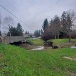 Andrea Watts / The Daily World
Although the banks of Camp Creek are lacking vegetation now, after the planting party scheduled for Feb. 7, the bank will be filled with willow, red osier dogwood, and spruce, Douglas-fir, and western redcedar seedlings. On the other side of the bridge, the creek channel has also responded to the increased flow.