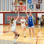 PHOTO BY MIKE ROBERTS Elmas Mikayla Roberts (5) shoots a three during a 55-31 loss to Hoquiam on Friday at Hoquiam Square Garden.