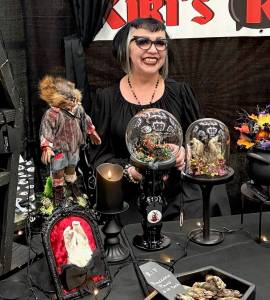 Jerry Knaak / The Daily World
The proprietor of Kikis Kauldron shows off her dental work at the Freaks at the Beach market at the Ocean Shores Convention Center.