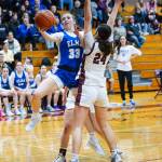 PHOTO BY MIKE ROBERTS 
Elma senior Olivia Moore (33) shoots around Montesanos Jillie Dalan during the Eagles 53-43 loss on Tuesday at Montesano High School.