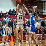 PHOTO BY FOREST WORGUM 
Montesanos Jillie Dalan (24) scores two of her game-high 24 points while Elmas Mercedes Carter defends in the Bulldogs 53-43 win on Tuesday in Montesano.