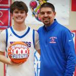 PHOTO BY BRYCE NEVA Willapa Valley senior Blane King (left) poses for a photo with head coach Derek Rask after eclipsing 1,000 points in his prep career during an 88-26 win over Mary M. Knight on Tuesday in Menlo.