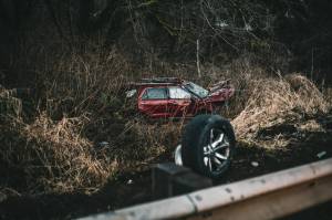 Jeff Clemens / Chinook Observer
Raymond woman attempted to pass struck in the southbound lane, and struck it on the front end of the drivers side. Her vehicle went over a guardrail, rolled down an embankment, and came to a rest along Smith Creek.