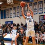 NICOLE SHANNON | MAIN FOCUS MEDIA Elmas Dylan Myer (13) scores from the paint during a 60-44 win over Montesano on Wednesday in Elma.