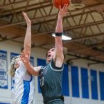 PHOTO BY FOREST WORGUM Montesano guard Ryan Weidman (12) shoots against Elmas Tanner Moe during the Eagles 60-44 win on Wednesday at Elma High School.