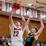 PHOTO BY FOREST WORGUM Hoquiams K.J. McCoy (22) puts up a shot against Aberdeens Gabe Matthews during the Grizzlies 69-60 win on Thursday at Hoquiam Square Garden.