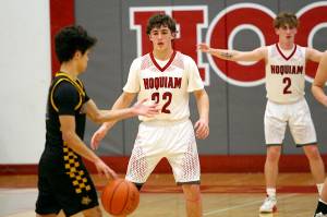 RYAN SPARKS | THE DAILY WORLD Hoquiams K.J. McCoy (22) defends Aberdeen guard Xanto Raya during the Grizzlies 69-60 win on Thursday at Hoquiam Square Garden.