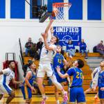 PHOTO BY MIKE ROBERTS Elmas Isaac McGaffey (3) scores two of his game-high 32 points in a 68-37 win over Rochester on Friday at Elma High School.
